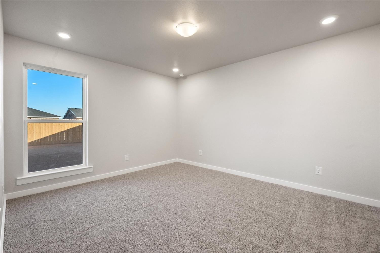 5516 Princeton Street Lubbock, TX 79416 - Photo 11 of 17 an empty room with a window