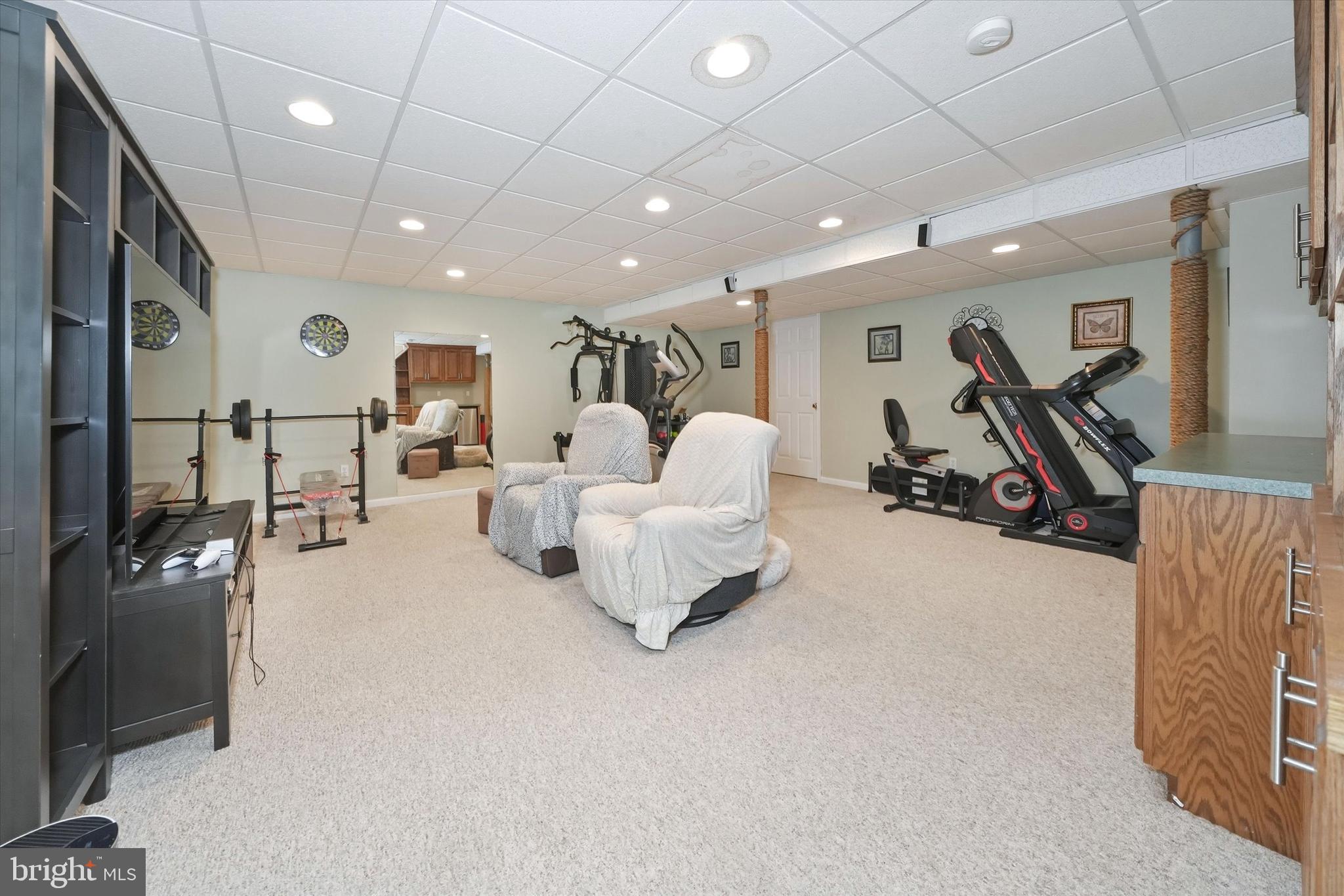 100 Cambridge Road Landenberg, PA 19350 - Photo 28 of 37 a large room with gym equipment and a large window