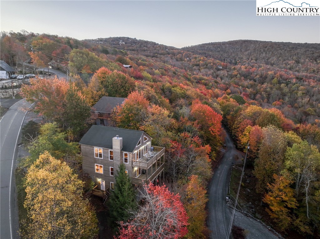 309 Pinnacle Ridge Road Beech Mountain, NC 28604 - Photo 3 of 45 an aerial view of a house with a mountain