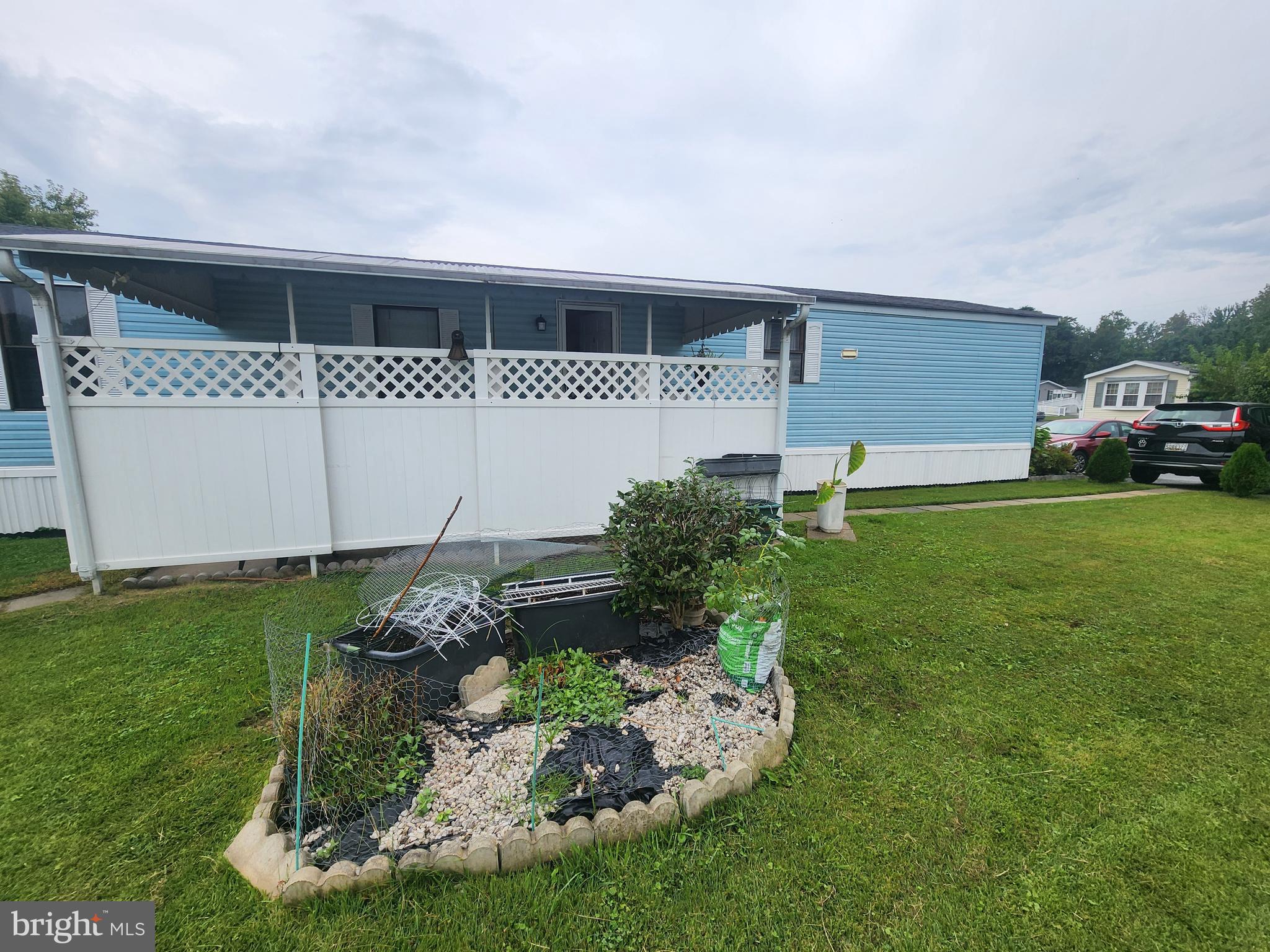 103 Rodeo Circle Middle River, MD 21220 - Photo 6 of 24 a front view of a house with garden