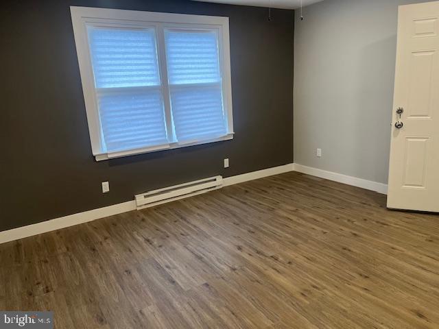 6339 Morton Street Philadelphia, PA 19144 - Photo 3 of 13 an empty room with wooden floor and windows