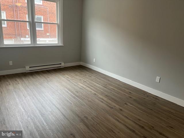 6339 Morton Street Philadelphia, PA 19144 - Photo 4 of 13 an empty room with wooden floor and windows