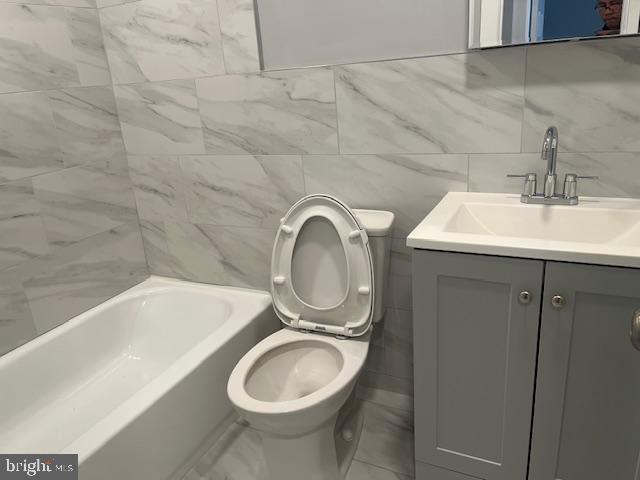 6339 Morton Street Philadelphia, PA 19144 - Photo 8 of 13 a bathroom with a sink and a toilet
