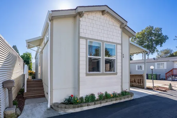 a front view of a house with garage