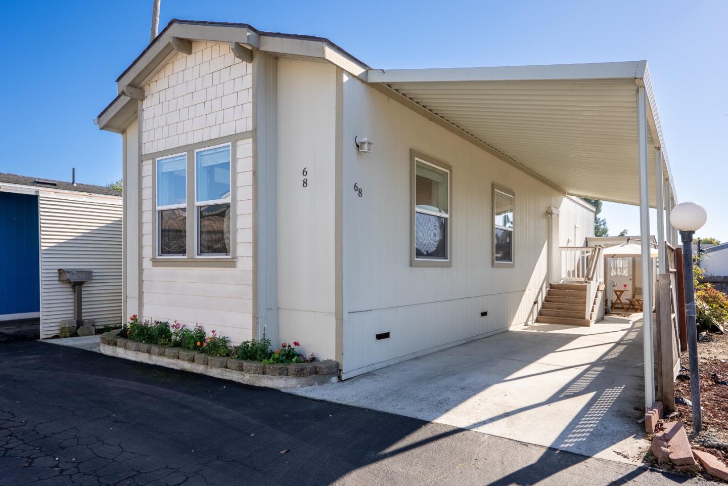 930 Rosedale Avenue, Unit 68 Capitola, CA 95010 - Photo 2 of 20 a front view of a house with garage