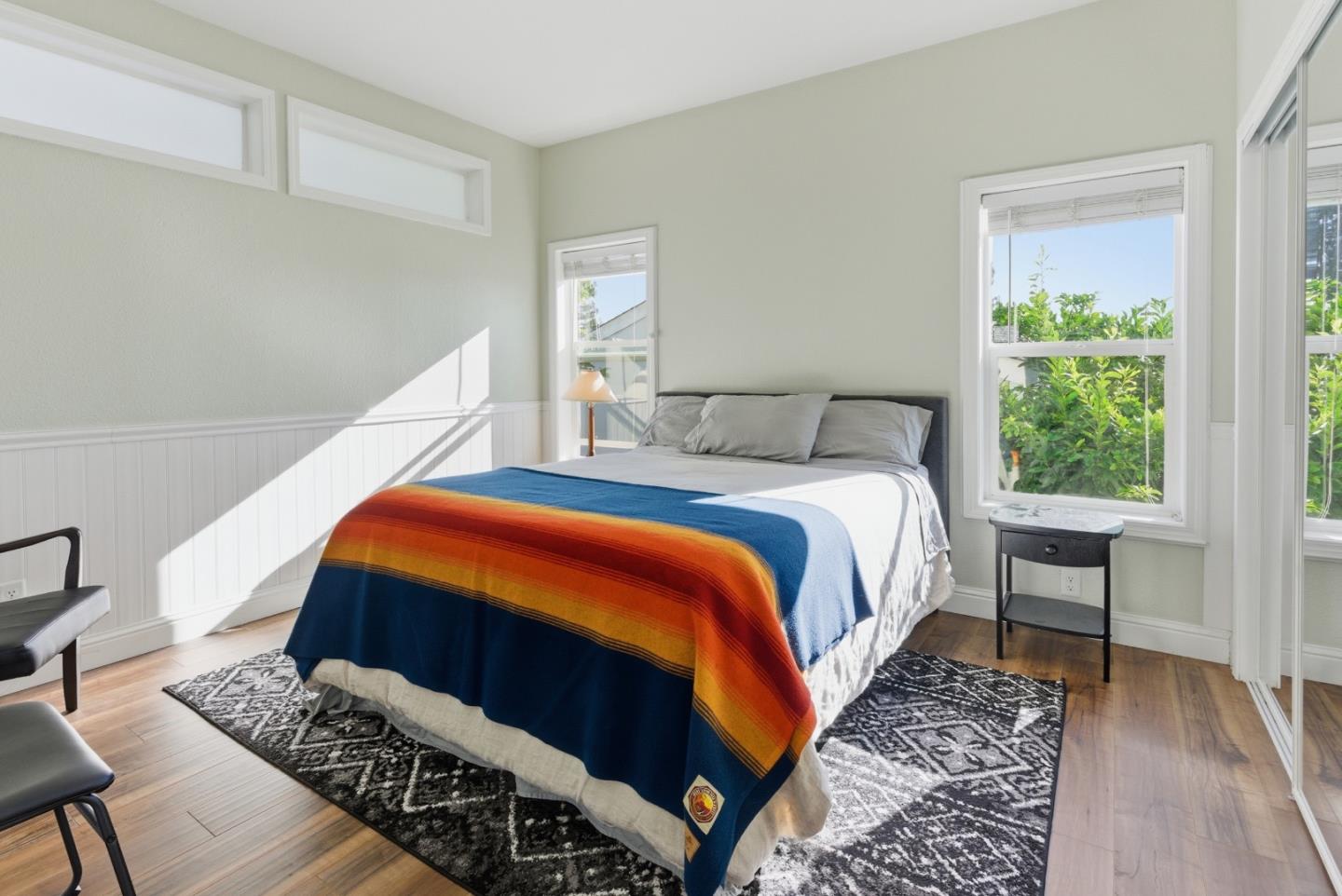 930 Rosedale Avenue, Unit 68 Capitola, CA 95010 - Photo 8 of 20 a bedroom with bed and wooden floor