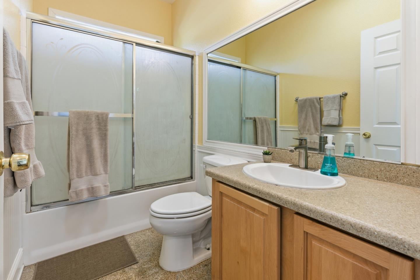 930 Rosedale Avenue, Unit 68 Capitola, CA 95010 - Photo 10 of 20 a bathroom with a granite countertop sink toilet and shower