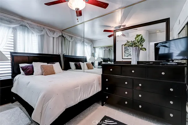 a bedroom with a bed and a dresser