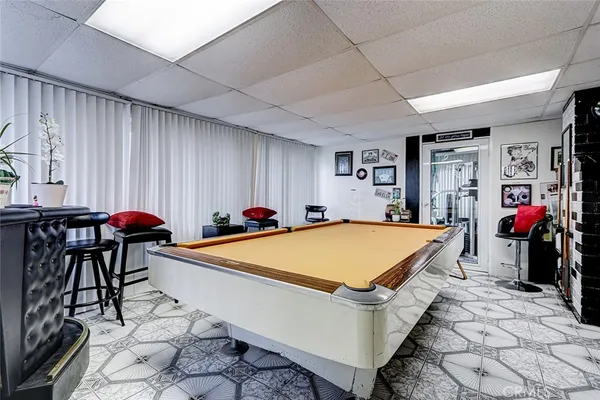 a room with furniture and air hockey table