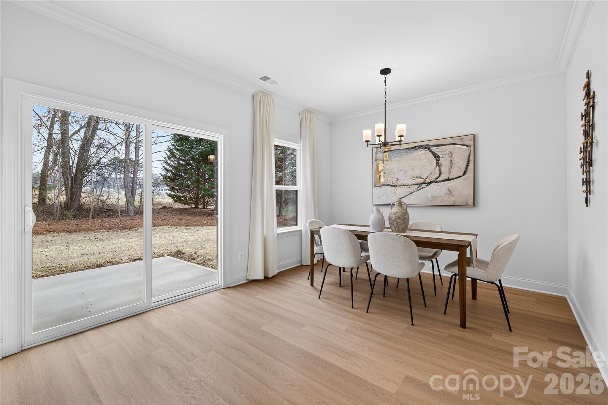 13103 Blacksmith Court Matthews, NC 28105 - Photo 15 of 32 a view of a dining room with furniture window and wooden floor