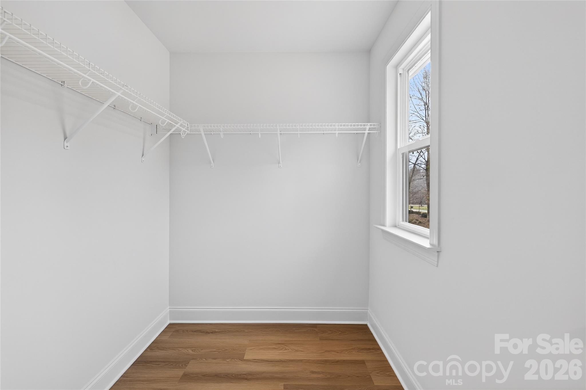 13103 Blacksmith Court Matthews, NC 28105 - Photo 25 of 32 a view of room with window and hardwood floor