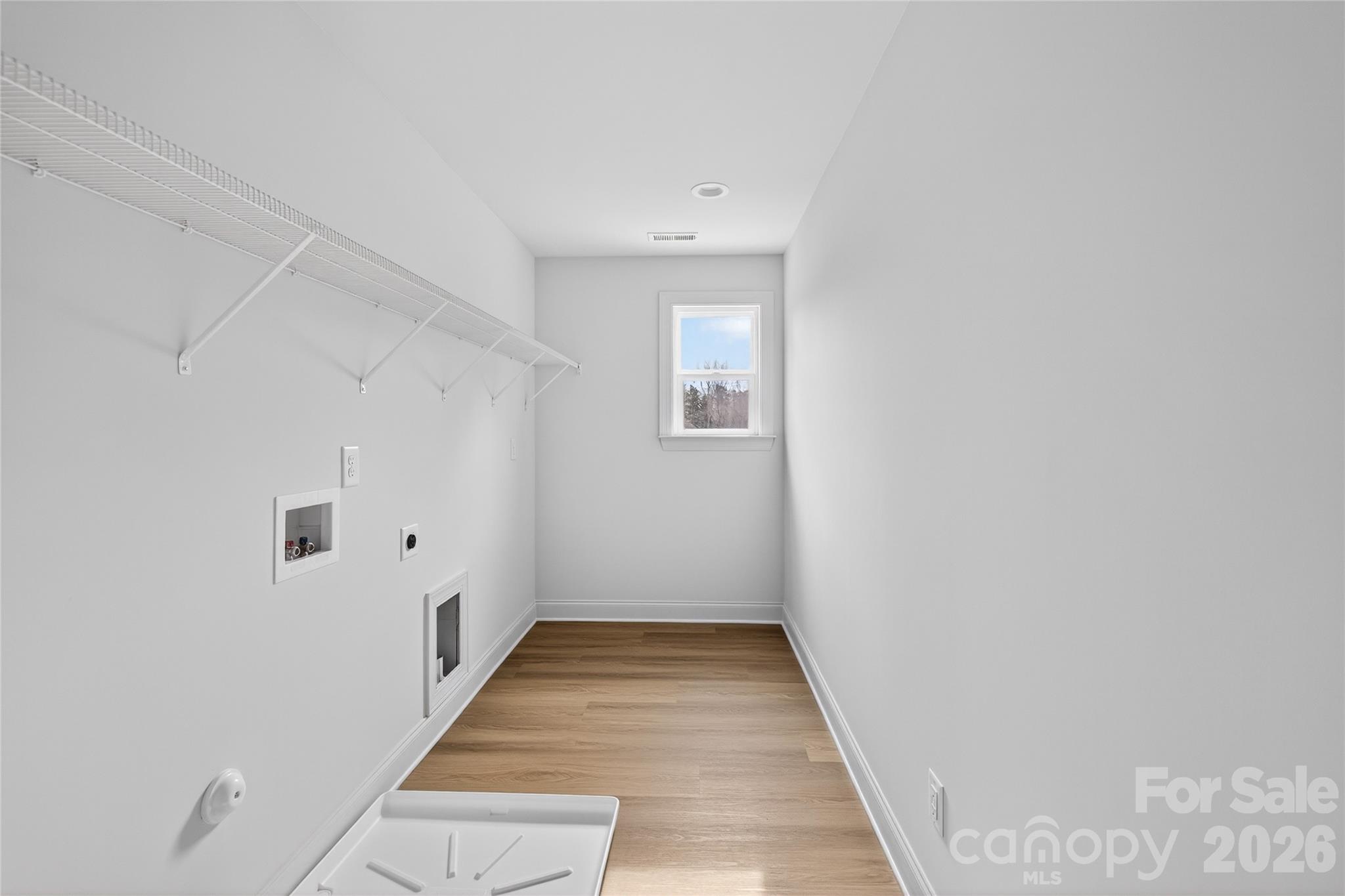 13103 Blacksmith Court Matthews, NC 28105 - Photo 29 of 32 a view of a hallway with wooden floor