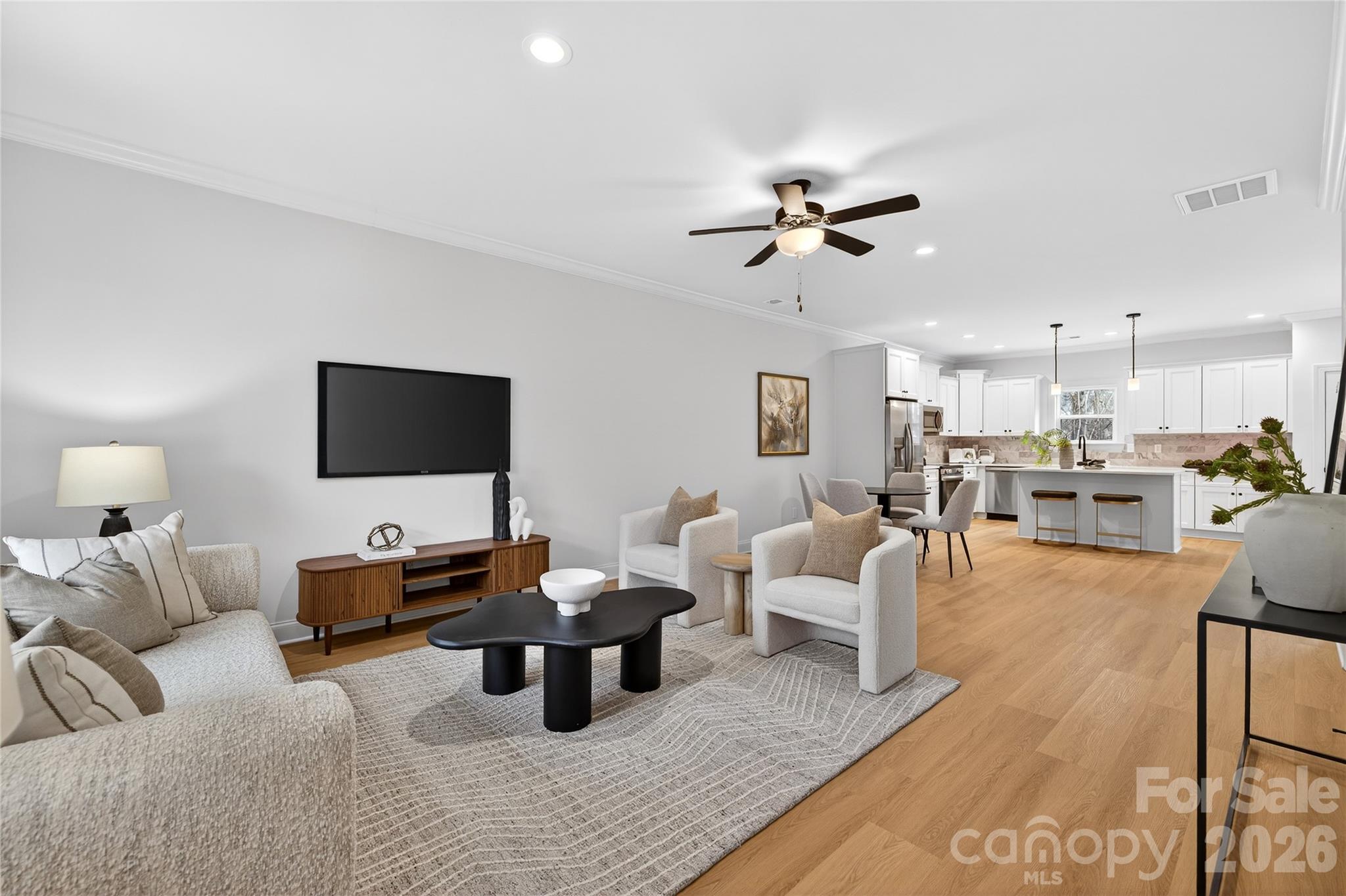 13103 Blacksmith Court Matthews, NC 28105 - Photo 3 of 32 a living room with furniture and a flat screen tv