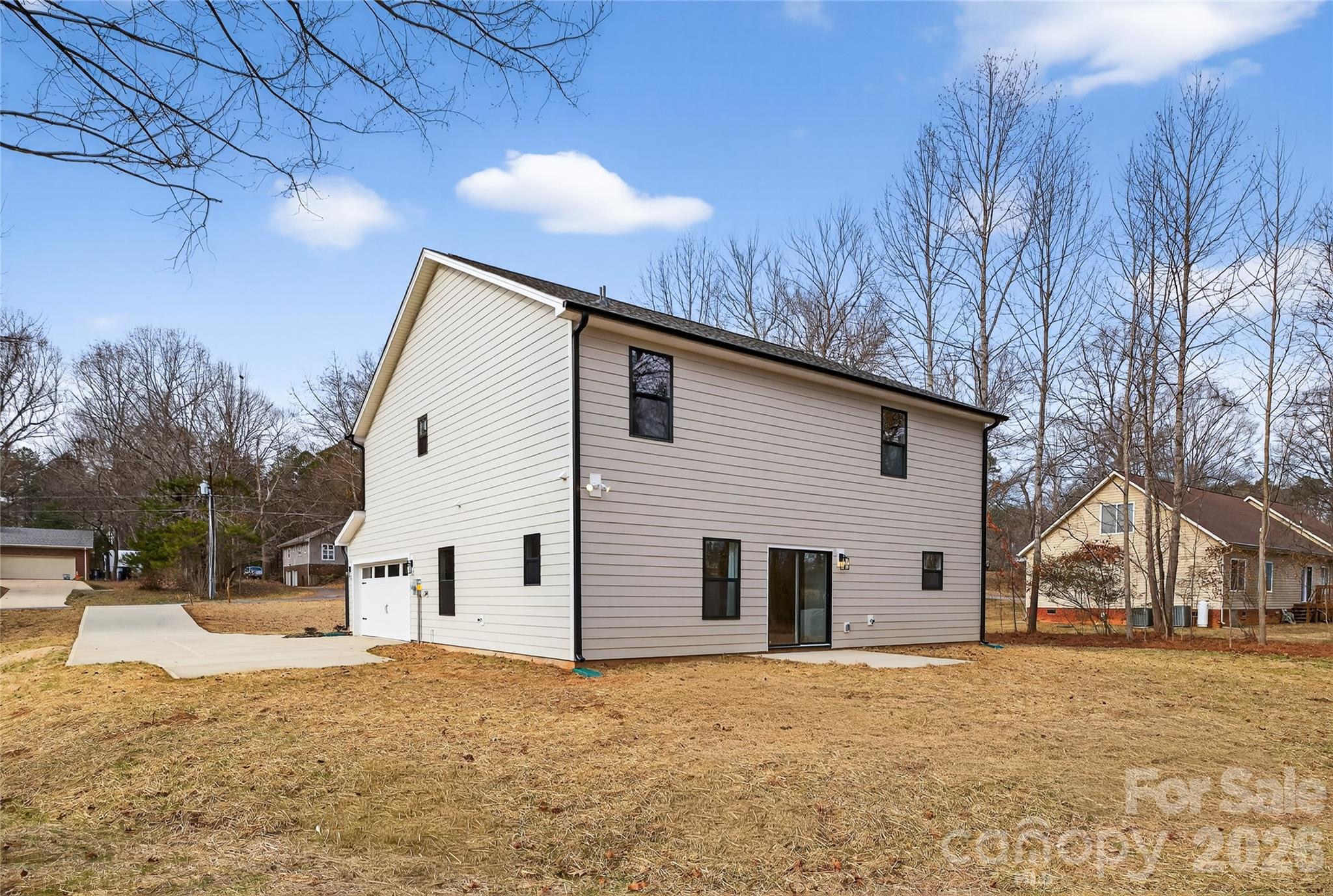 13103 Blacksmith Court Matthews, NC 28105 - Photo 32 of 32 a view of a house with snow on the road