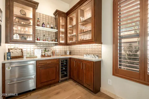 a living room with furniture a ceiling fan and a window