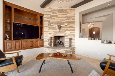 a view of a livingroom with furniture and a fireplace