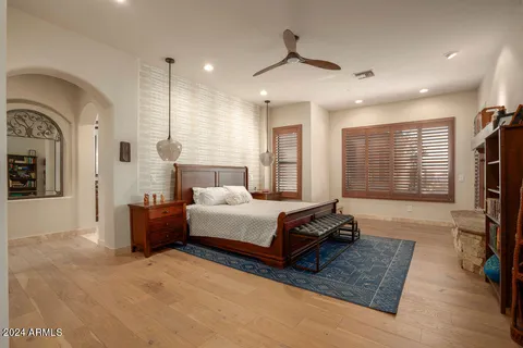 a bedroom with furniture and a window