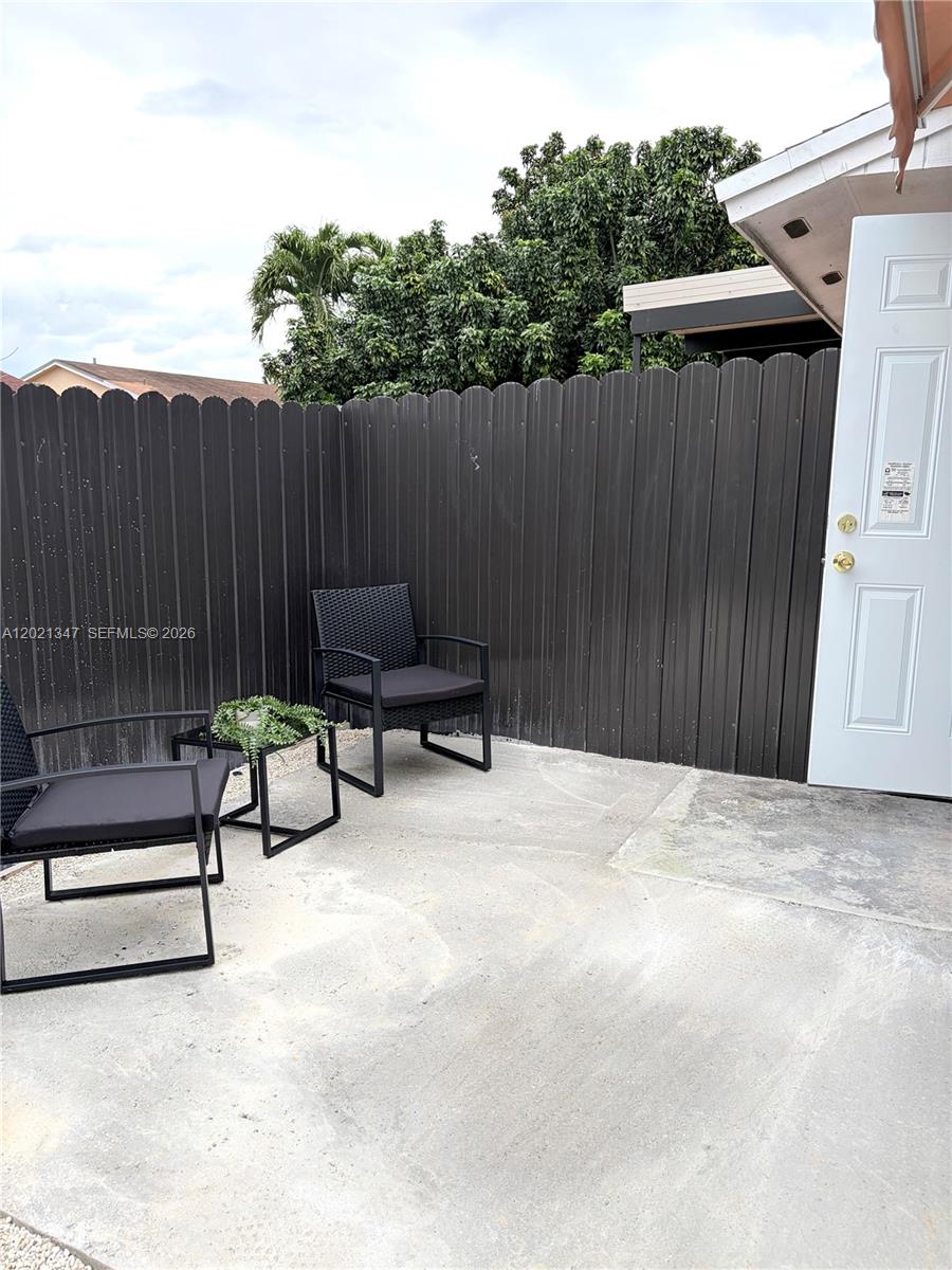 13065 Southwest 263rd Terrace, Unit 2 Homestead, FL 33032 - Photo 4 of 15 a view of outdoor space with furniture