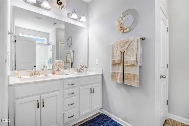 a bedroom with a flat screen television and a bed