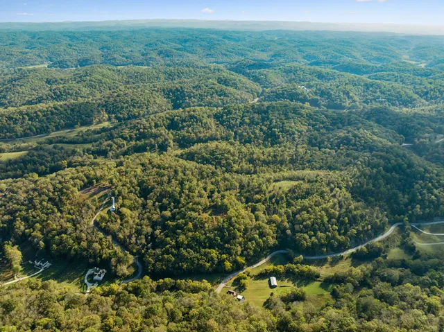 a view of a field with an ocean view
