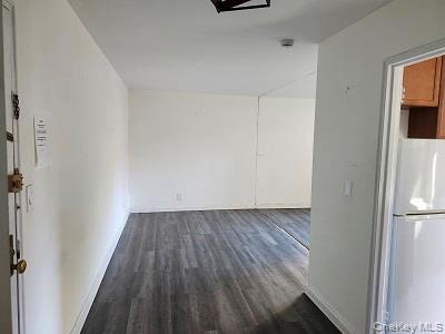 485 Bronx River Road, Unit B15 Yonkers, NY 10704 - Photo 7 of 8 a view of a closet with wooden floor