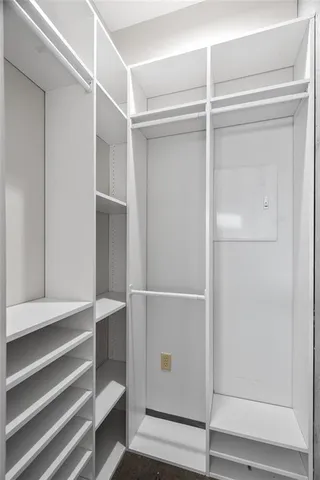 a bathroom with a granite countertop sink toilet and mirror