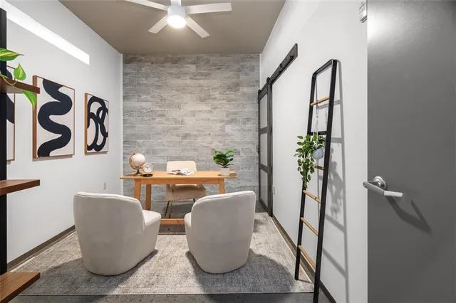 a view of a dining room with table chairs and plants
