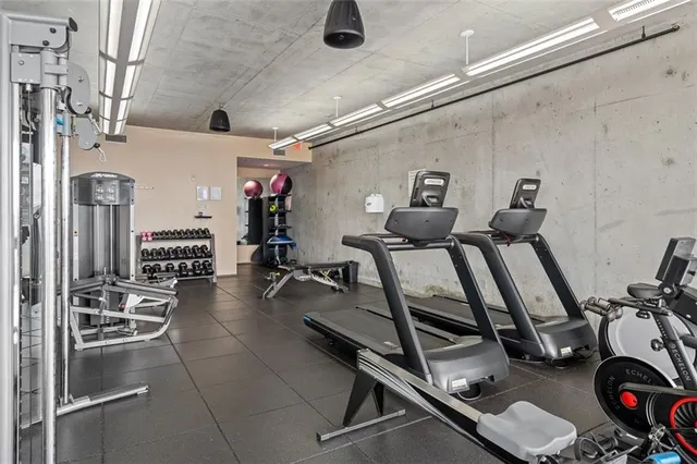 a gym room with lots of gym equipment