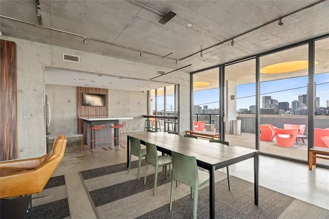 a outdoor space with a large window and furniture