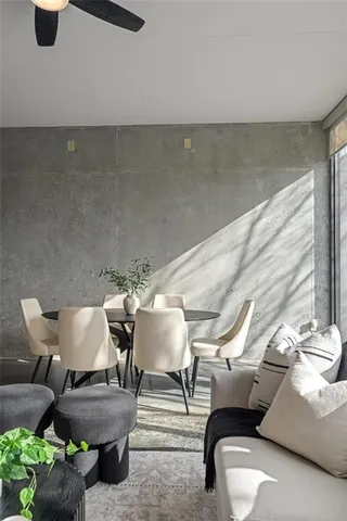 a dining room with furniture a window and kitchen view