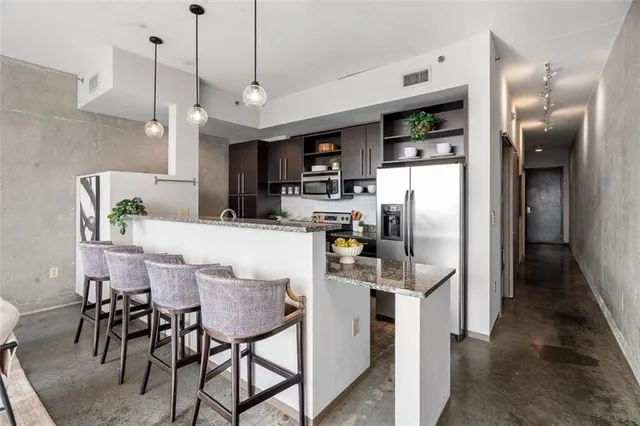 a view of kitchen and dining area with furniture