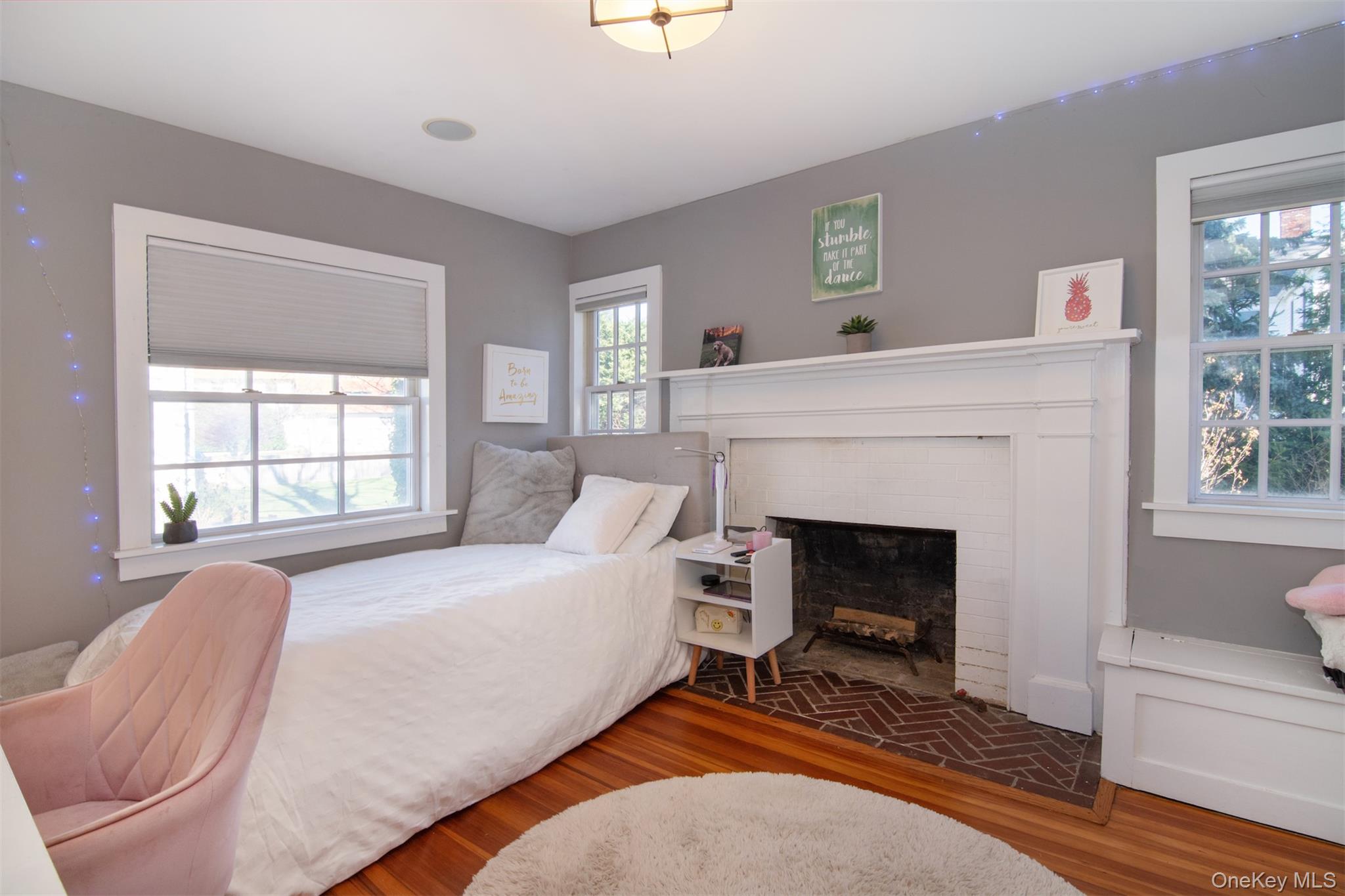 414 Pelham Manor Road Pelham, NY 10803 - Photo 18 of 32 a living room with furniture and a fireplace