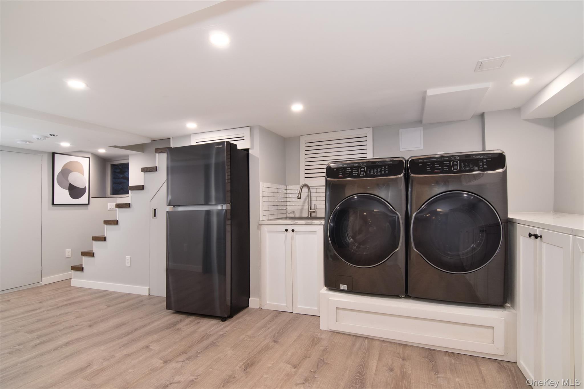 414 Pelham Manor Road Pelham, NY 10803 - Photo 23 of 32 a view of a hallway with washer and dryer