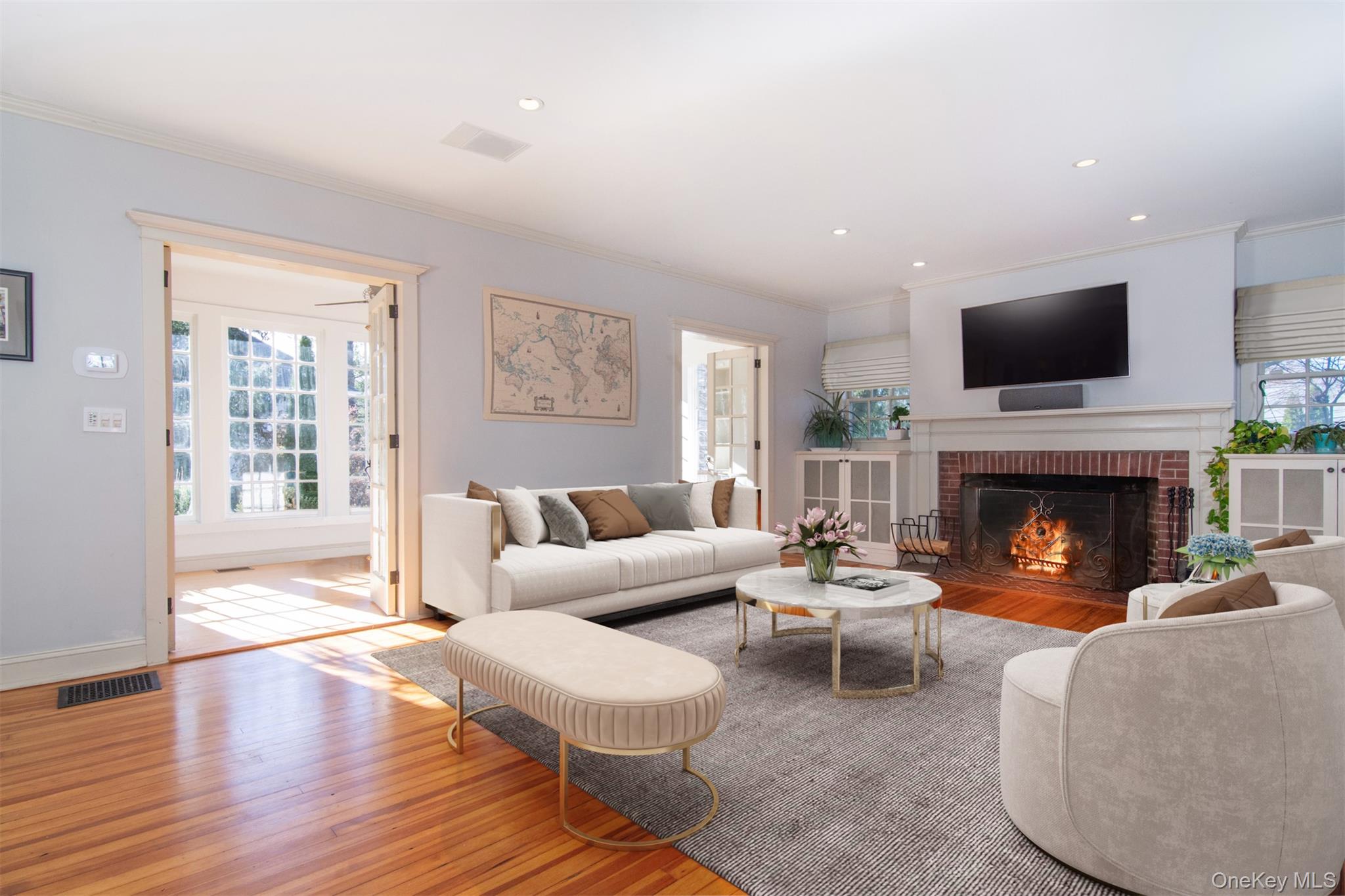 414 Pelham Manor Road Pelham, NY 10803 - Photo 4 of 32 a living room with furniture a flat screen tv and a fireplace