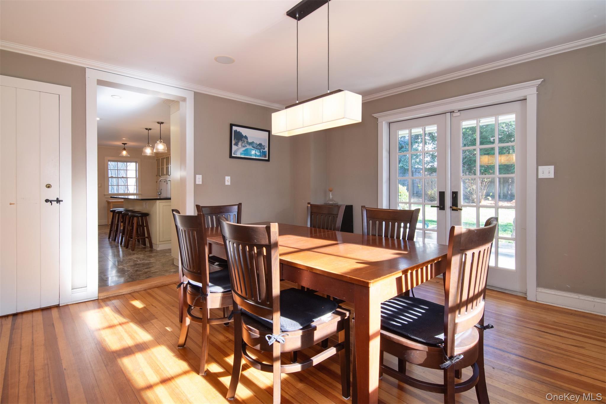 414 Pelham Manor Road Pelham, NY 10803 - Photo 10 of 32 a view of a dining room with furniture window and wooden floor