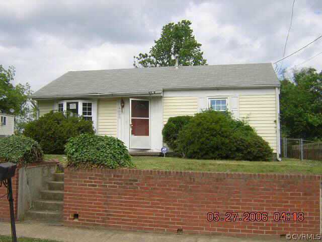 4000 Castlewood Road Richmond, VA 23234 - Photo 1 of 2 a front view of a house with garden