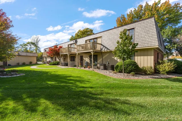 a view of a house with a yard porch and sitting area