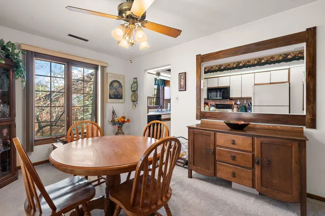 a view of a dining room with furniture window and outside view