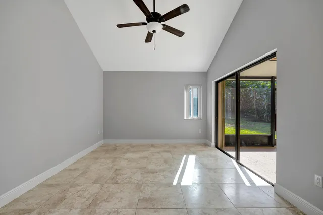 a view of a hallway with wooden shelves