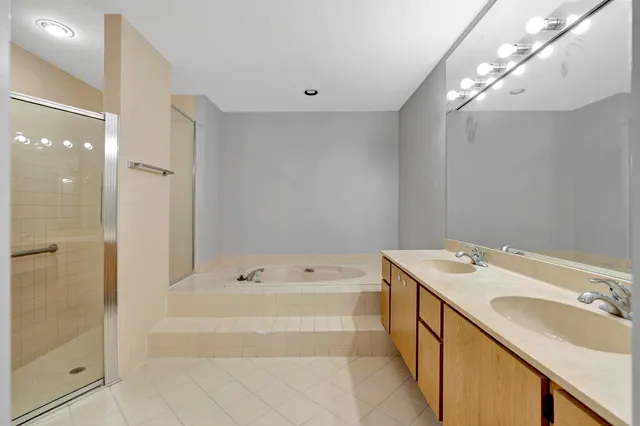 a bathroom with a bathtub and a shower