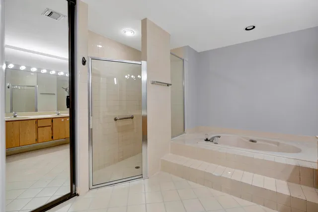 a view of an empty room with a ceiling fan