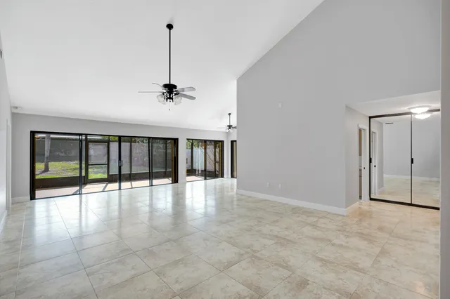 a hallway with sink and large window