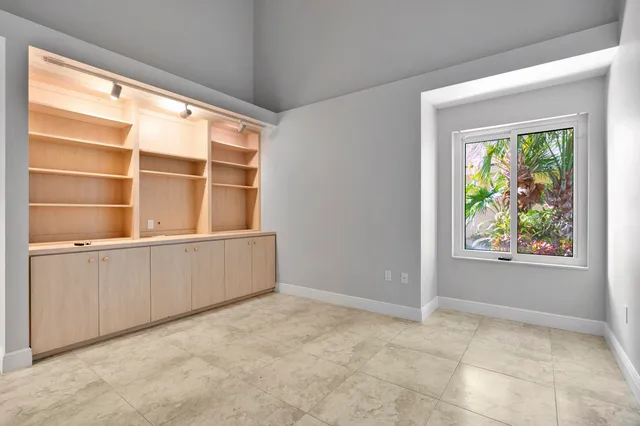 a bathroom with a sink a toilet a mirror and shower