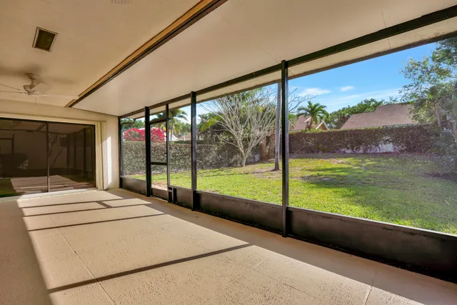 an aerial view of a house with an outdoor space