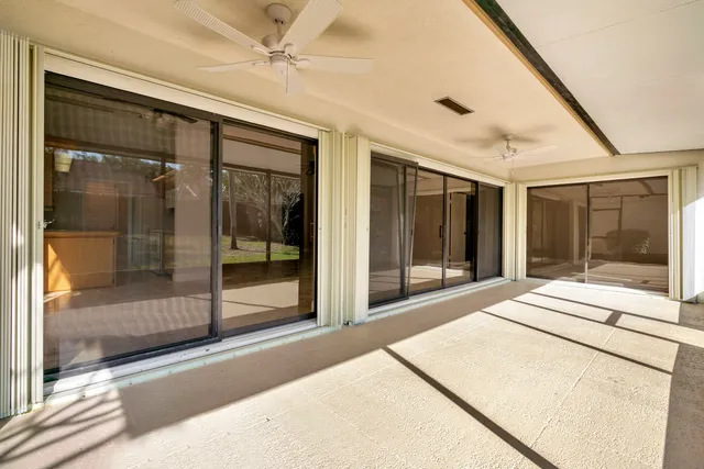an aerial view of a house with a yard and garden