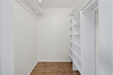 a view of an empty walk in closet