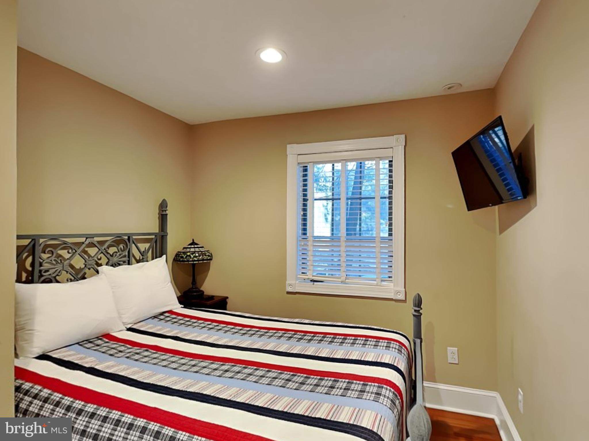 3067 Shingle Camp Road McHenry, MD 21541 - Photo 27 of 68 a bedroom with a bed and a television