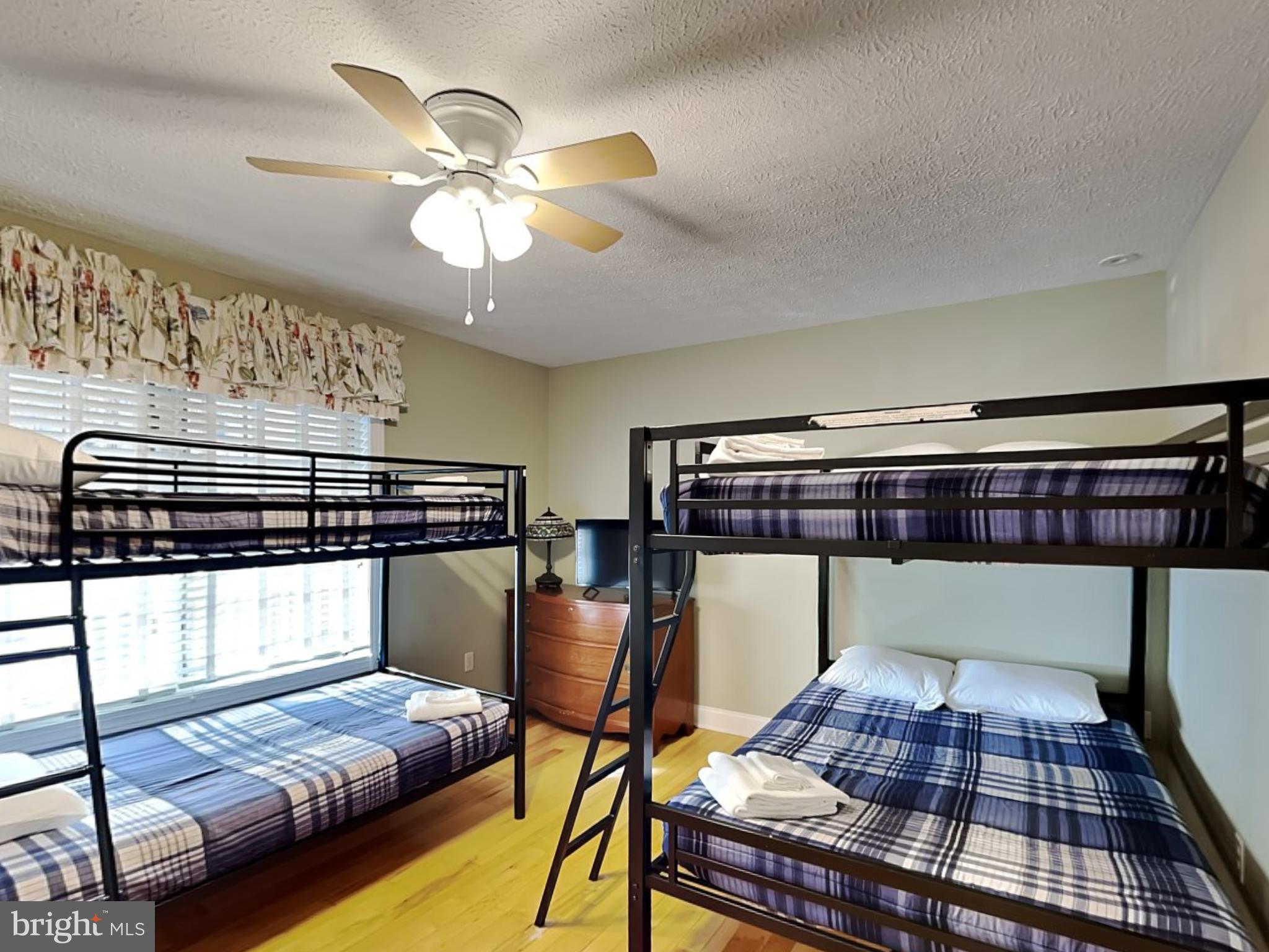 3067 Shingle Camp Road McHenry, MD 21541 - Photo 28 of 68 a bedroom with a bed and a chandelier