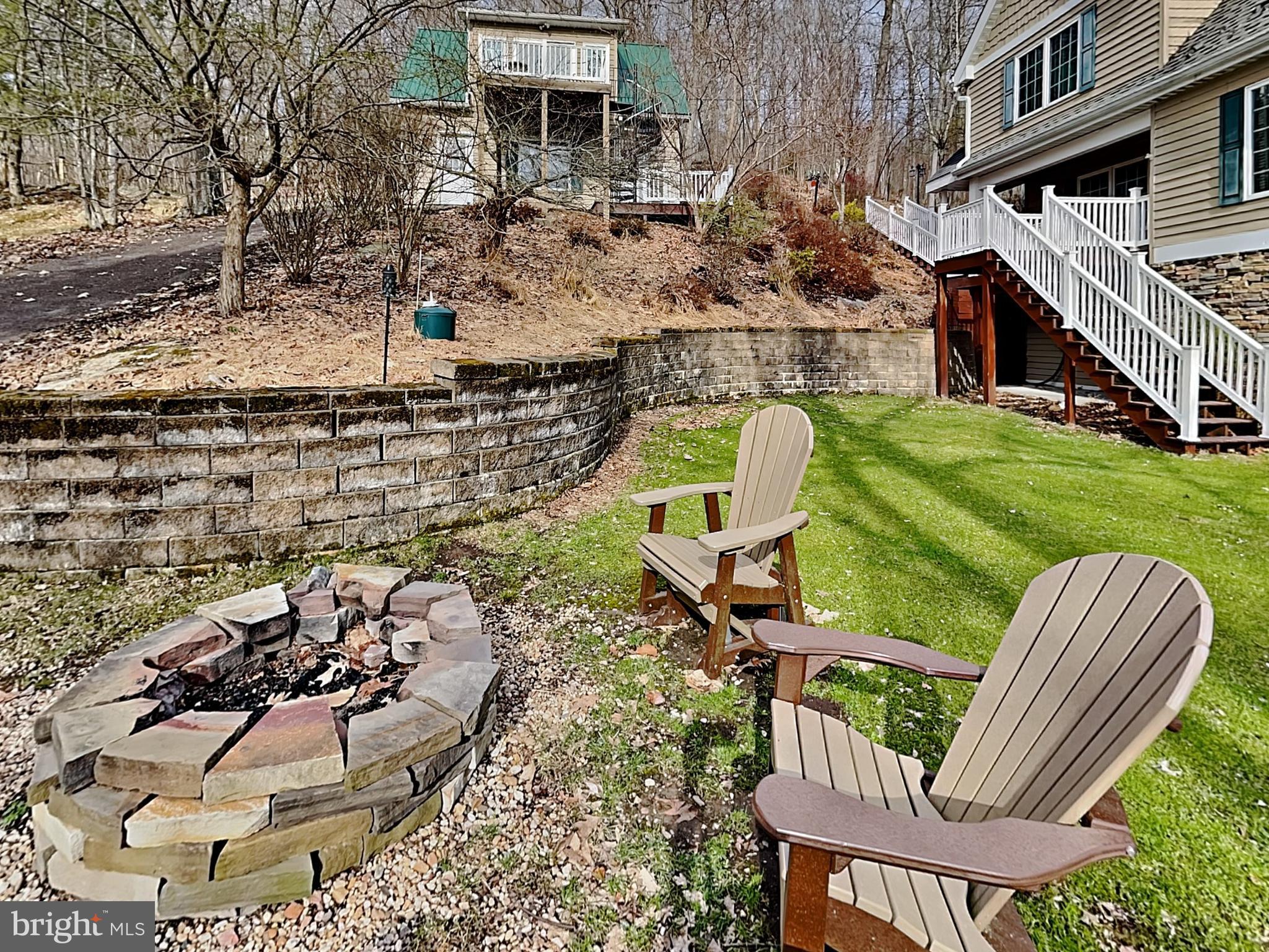 3067 Shingle Camp Road McHenry, MD 21541 - Photo 30 of 68 a view of a chairs and table in backyard