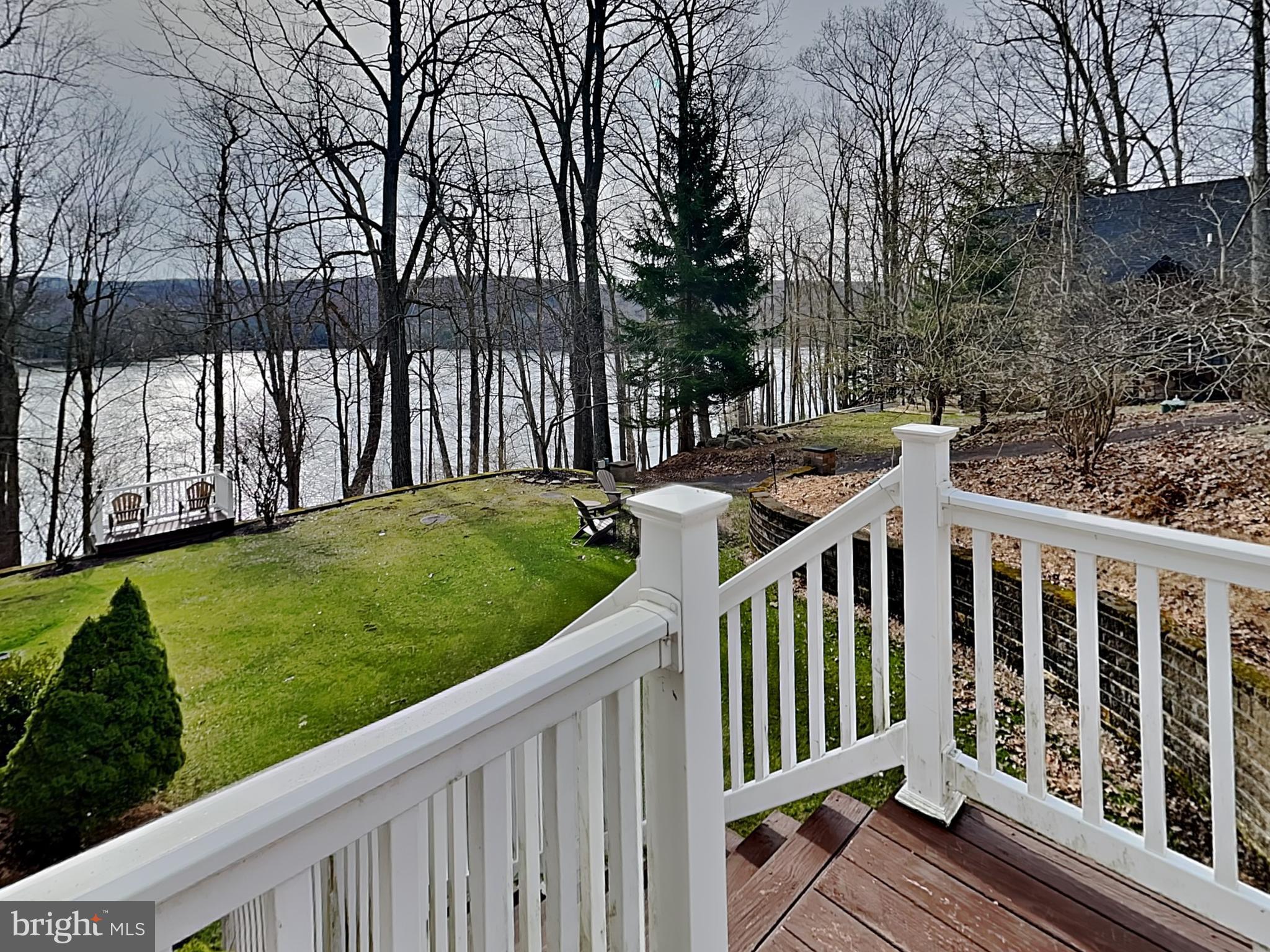 3067 Shingle Camp Road McHenry, MD 21541 - Photo 35 of 68 a view of a wooden deck and a yard with wooden fence